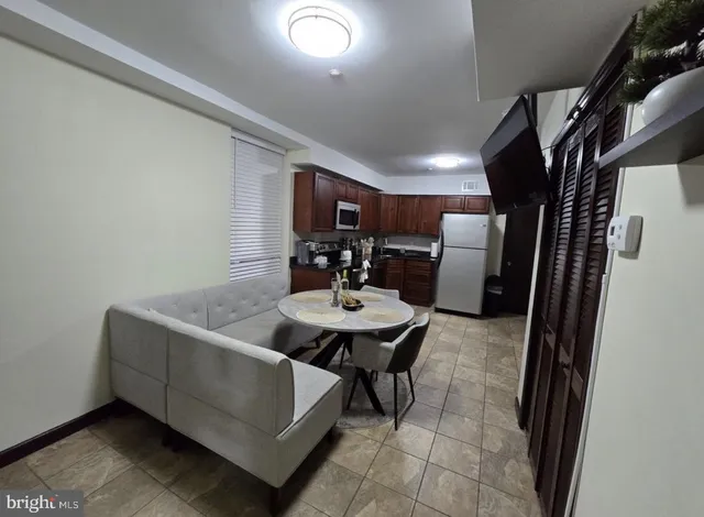 a view of a livingroom with furniture and window