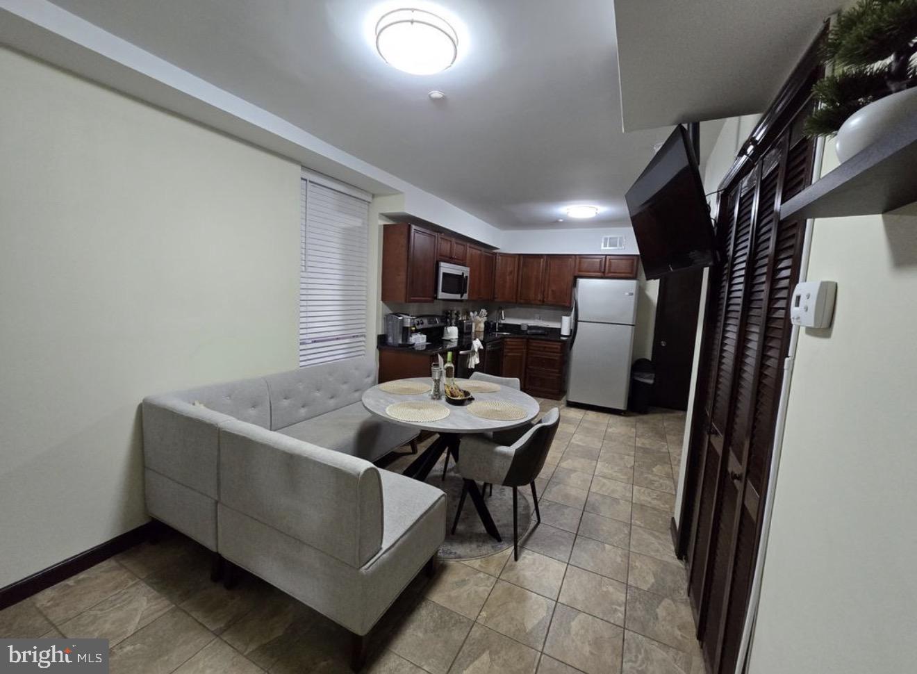 230 Market Street, Unit 4 Philadelphia, PA 19106 - Photo 4 of 10 a view of a livingroom with furniture and window