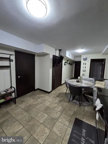 a view of a livingroom with furniture and a table