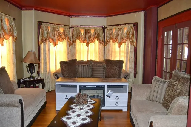 a dining room with furniture and window