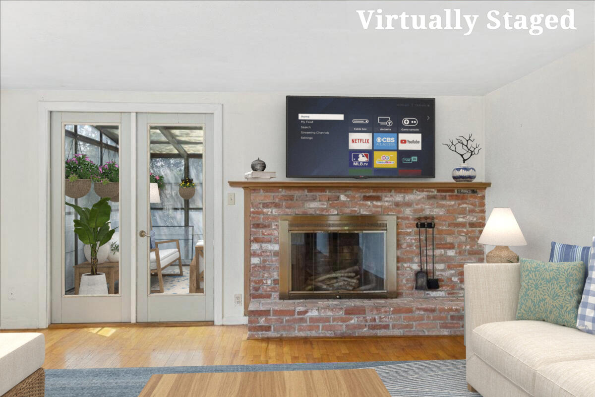 34 Scatteree Road North Chatham, MA 02650 - Photo 11 of 40 a living room with furniture and a fireplace