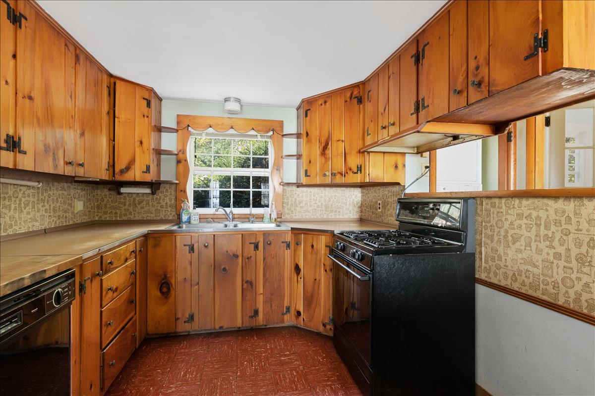 34 Scatteree Road North Chatham, MA 02650 - Photo 13 of 40 a kitchen with stainless steel appliances granite countertop a stove a sink and a microwave