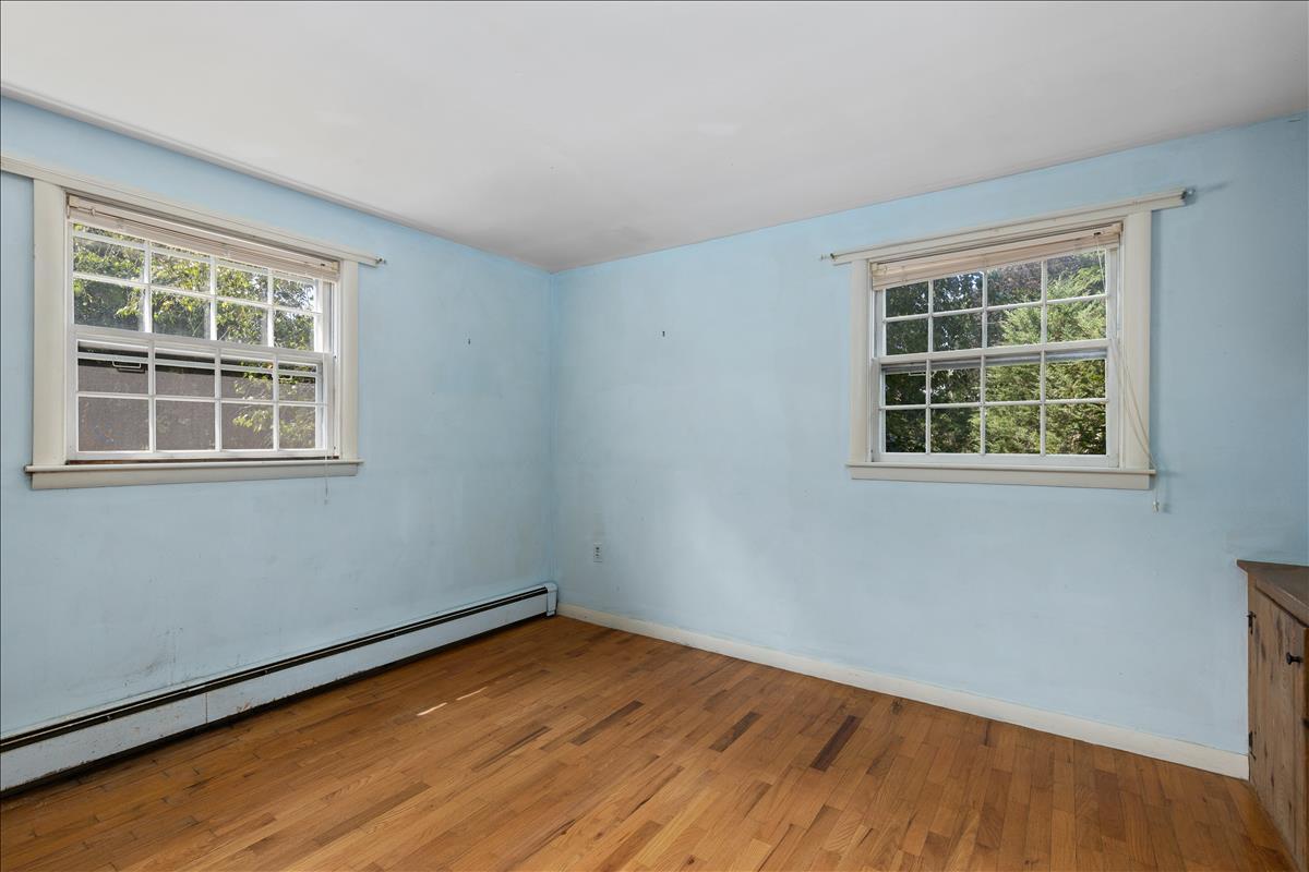 34 Scatteree Road North Chatham, MA 02650 - Photo 27 of 40 a view of empty room with wooden floor and fan