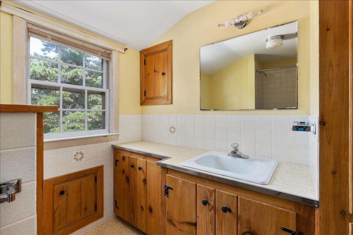 34 Scatteree Road North Chatham, MA 02650 - Photo 37 of 40 a bathroom with a sink and a mirror