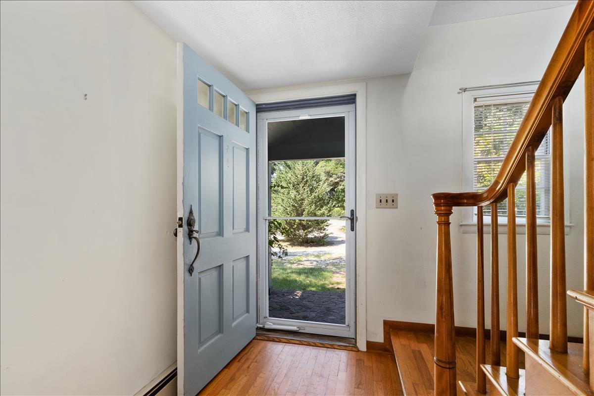 34 Scatteree Road North Chatham, MA 02650 - Photo 7 of 40 a view of an entryway with wooden floor and door