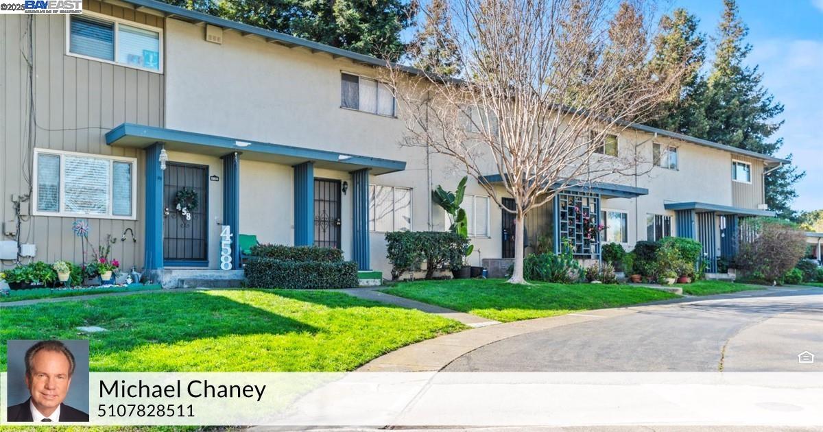 462 Craven Court Hayward, CA 94541 - Photo 2 of 50 a view of a brick house with a yard plants and large trees