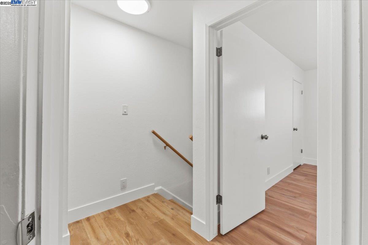 462 Craven Court Hayward, CA 94541 - Photo 24 of 50 a view of a hallway with wooden floor and staircase