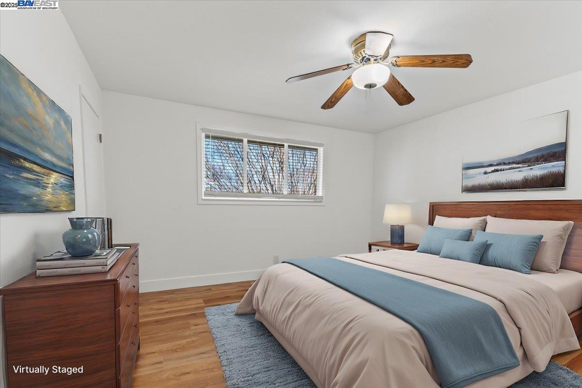 462 Craven Court Hayward, CA 94541 - Photo 3 of 50 a bedroom with a large bed and a chandelier