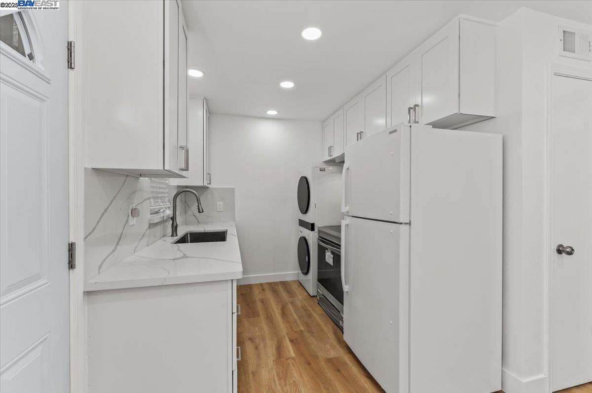 462 Craven Court Hayward, CA 94541 - Photo 39 of 50 a kitchen with refrigerator cabinets and a sink