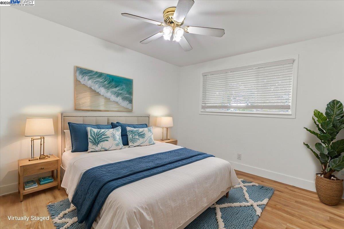 462 Craven Court Hayward, CA 94541 - Photo 4 of 50 a bedroom with a bed and a potted plant