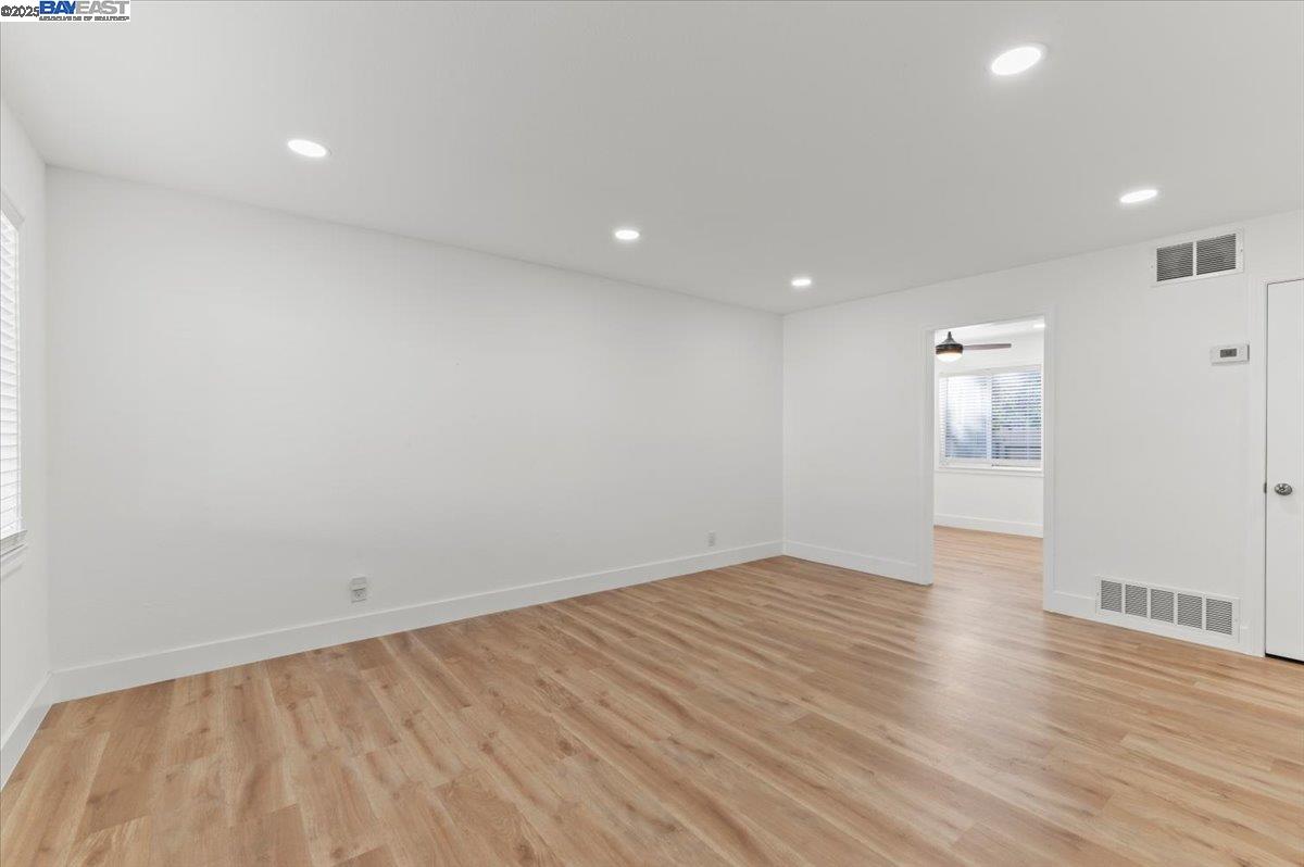 462 Craven Court Hayward, CA 94541 - Photo 41 of 50 an empty room with wooden floor and windows