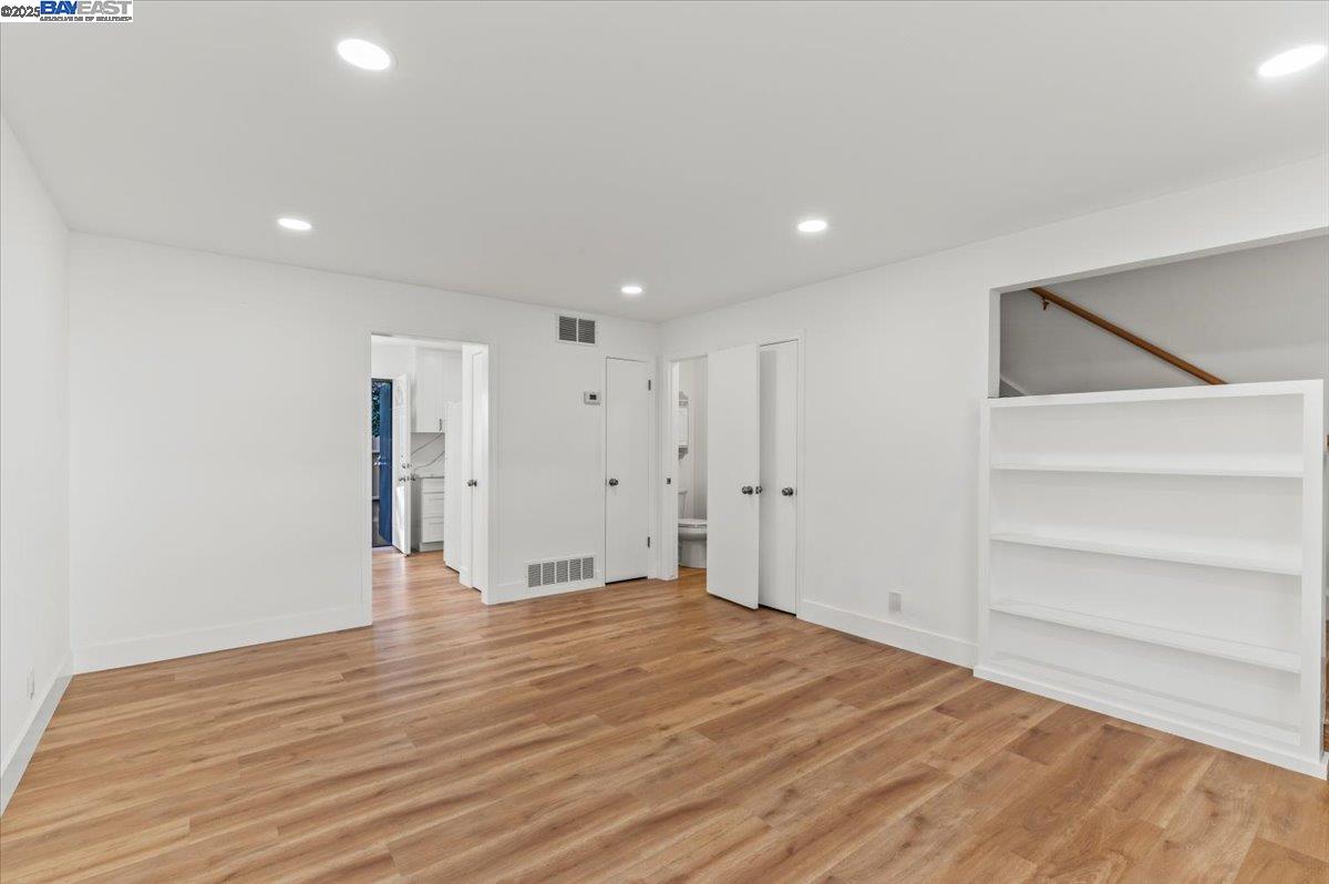 462 Craven Court Hayward, CA 94541 - Photo 43 of 50 a view of an empty room with wooden floor and entryway