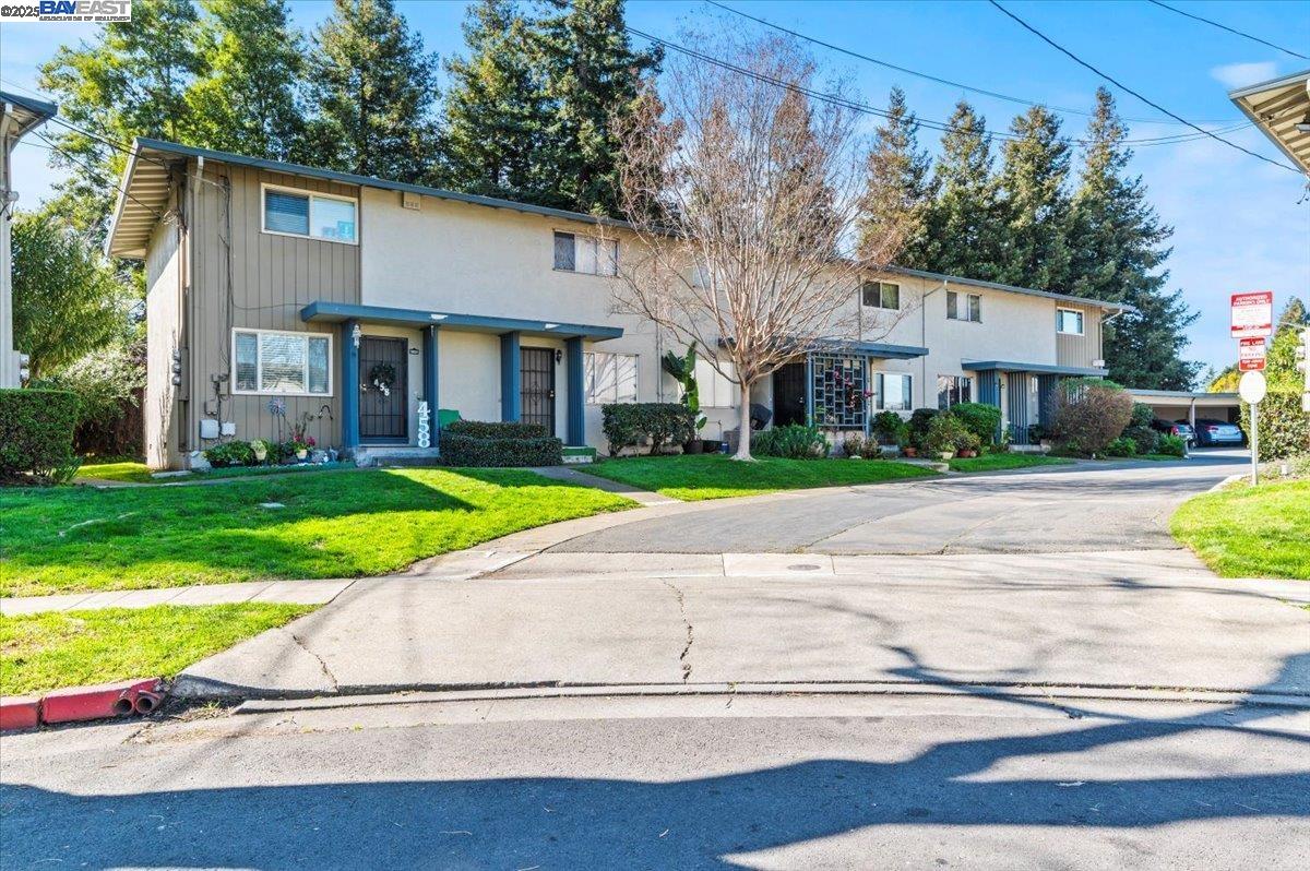 462 Craven Court Hayward, CA 94541 - Photo 50 of 50 a view of a white house with a big yard plants and large trees