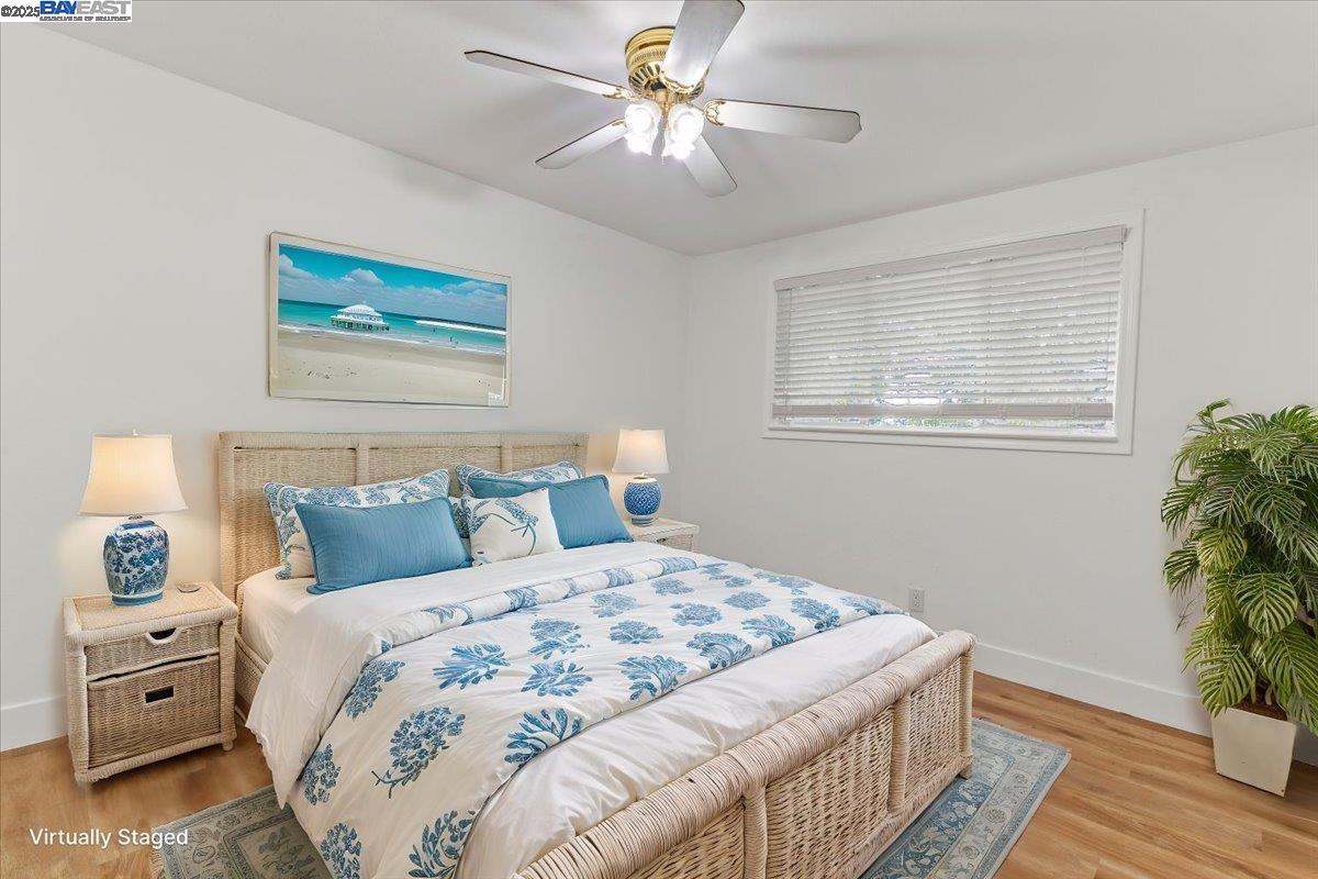 462 Craven Court Hayward, CA 94541 - Photo 5 of 50 a bedroom with a large bed and a chandelier