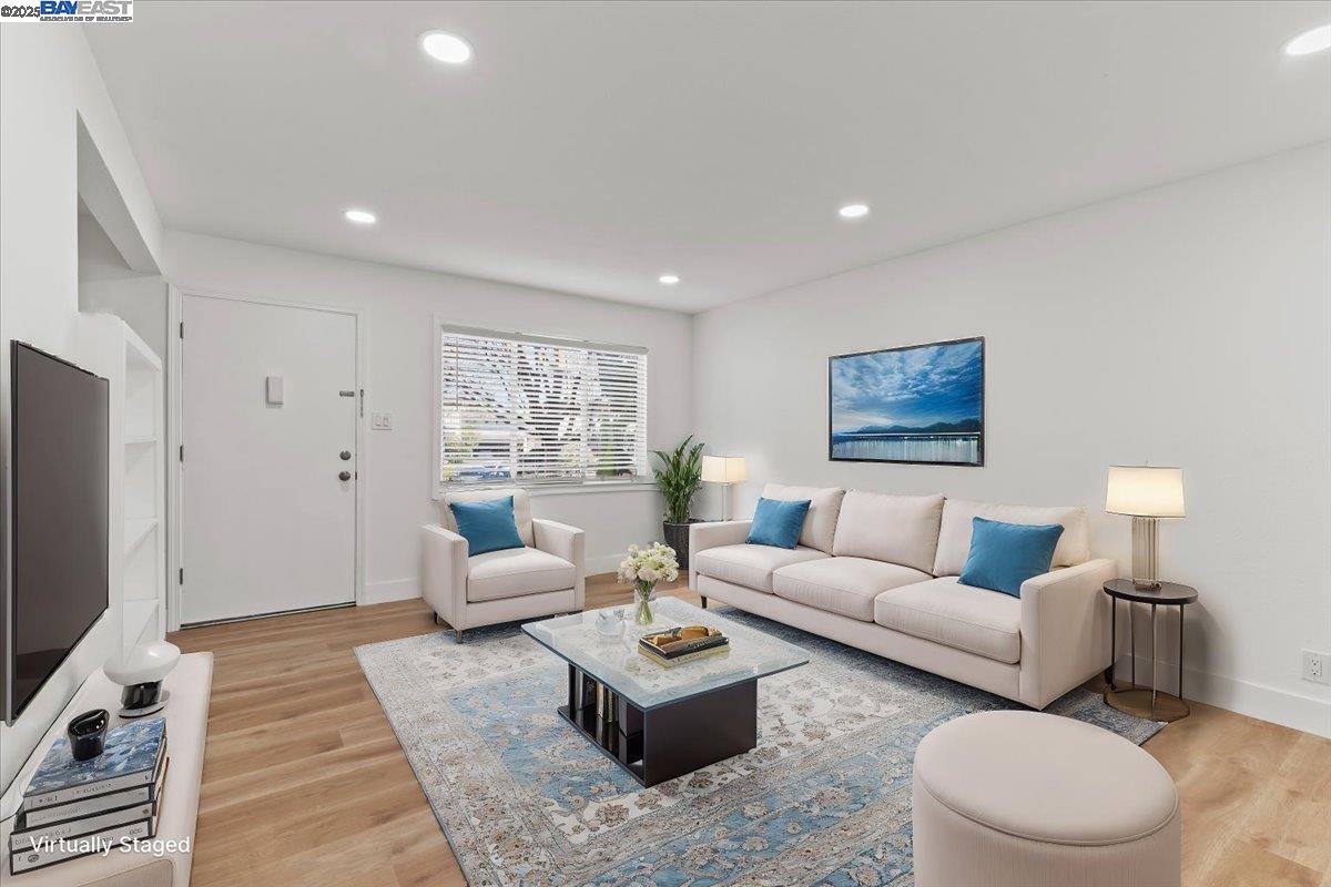 462 Craven Court Hayward, CA 94541 - Photo 7 of 50 a living room with furniture a rug and a flat screen tv