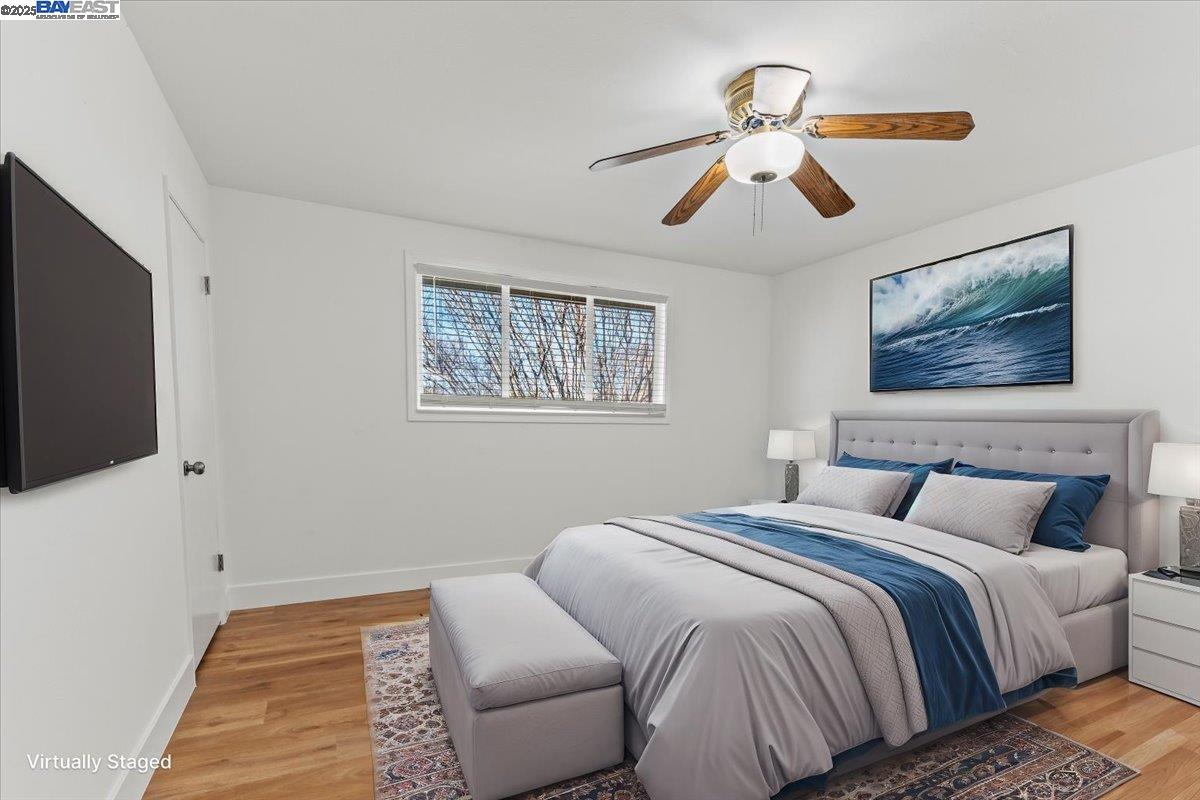 462 Craven Court Hayward, CA 94541 - Photo 8 of 50 a bedroom with a large bed and a flat screen tv