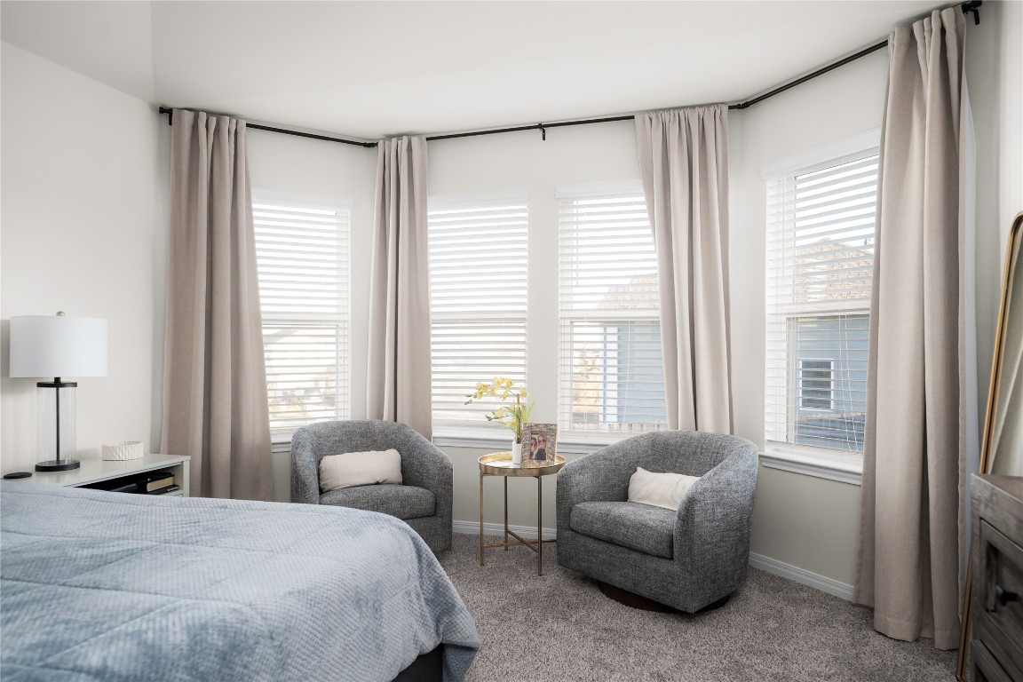 6511 Rounded Pebble Lane Buda, TX 78610 - Photo 11 of 25 Carpeted bedroom with baseboards