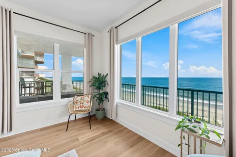 a view of walk in closet with clothes