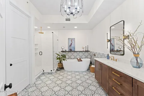 a bed room with a bed and a view of bathroom