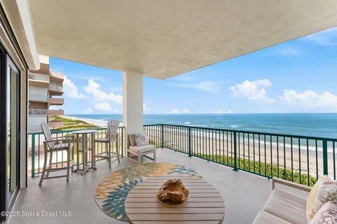 a view of a workspace with furniture and a living room