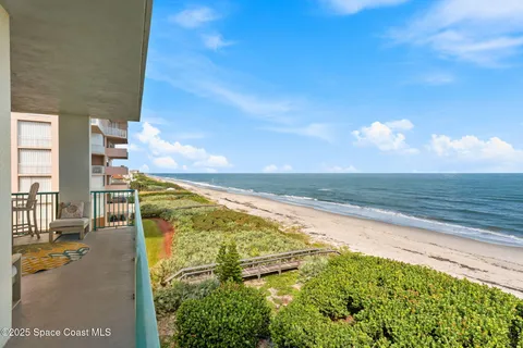 a view of a swimming pool with a lounge chairs