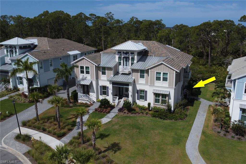 6509 Dominica Drive, Unit 101 Naples, FL 34113 - Photo 22 of 33 an aerial view of a house with a garden