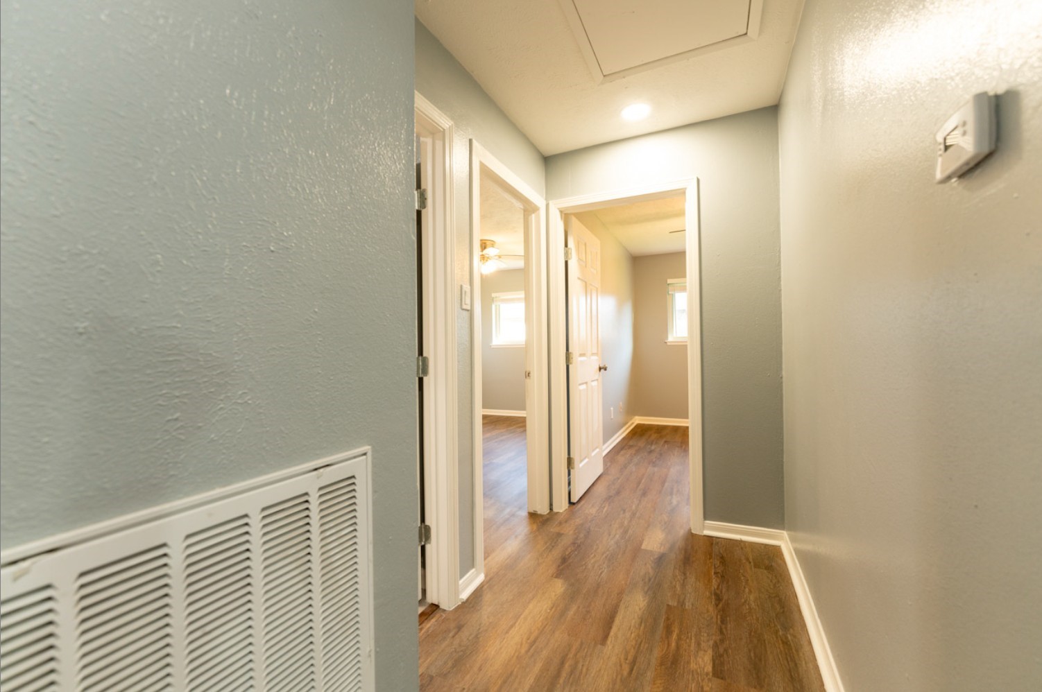 11803 Brook Meadows Lane Meadows Place, TX 77477 - Photo 12 of 17 a view of a hallway with wooden floor