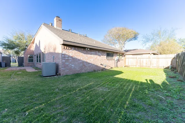 a view of a house with a back yard