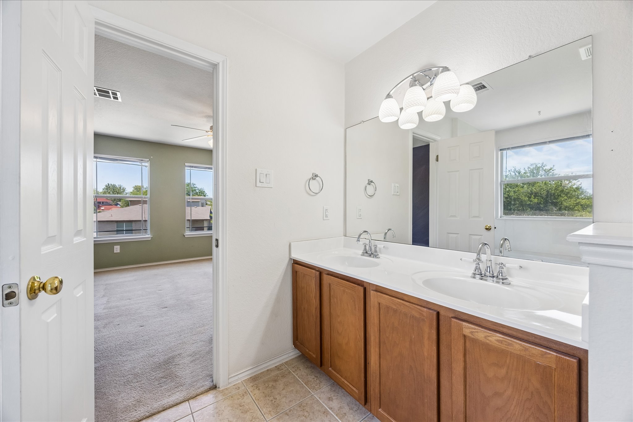 338 Spring Branch Loop Kyle, TX 78640 - Photo 20 of 36 Double vanity in this bathroom provides convenience and ample space.