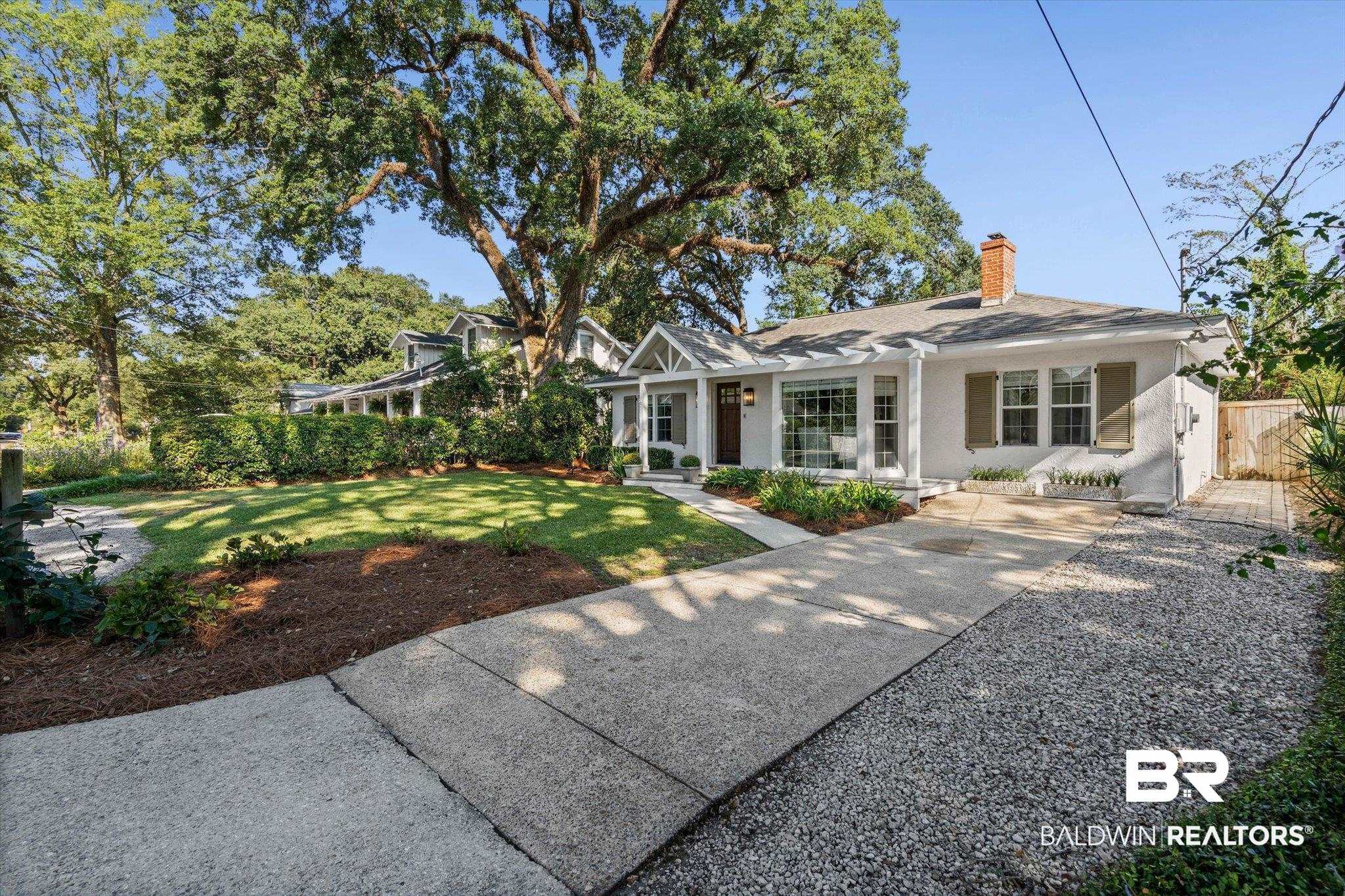 4310 The Cedars Avenue Mobile, AL 36608 - Photo 28 of 32 Back of property with covered porch and a chimney