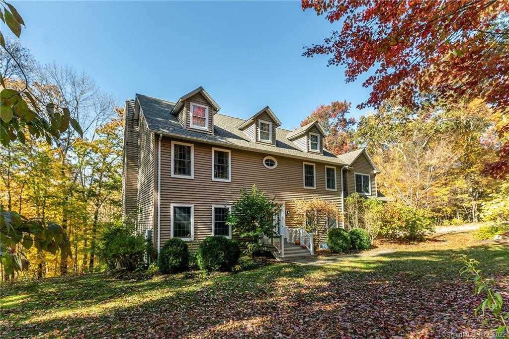 29 Iron Mountain Road Kent, CT 06757 - Photo 1 of 1 a front view of a house with garden
