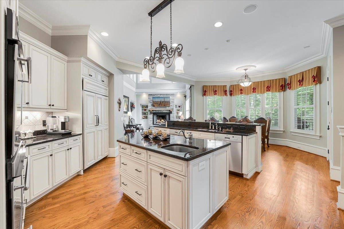9712 Honeycutt Road Raleigh, NC 27614 - Photo 13 of 83 a kitchen with stainless steel appliances granite countertop a sink stove and refrigerator