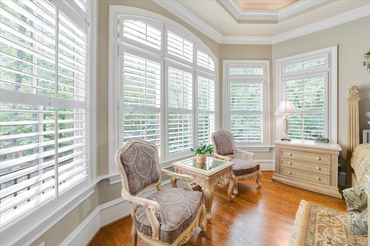 9712 Honeycutt Road Raleigh, NC 27614 - Photo 23 of 83 a living room with furniture and floor to ceiling windows