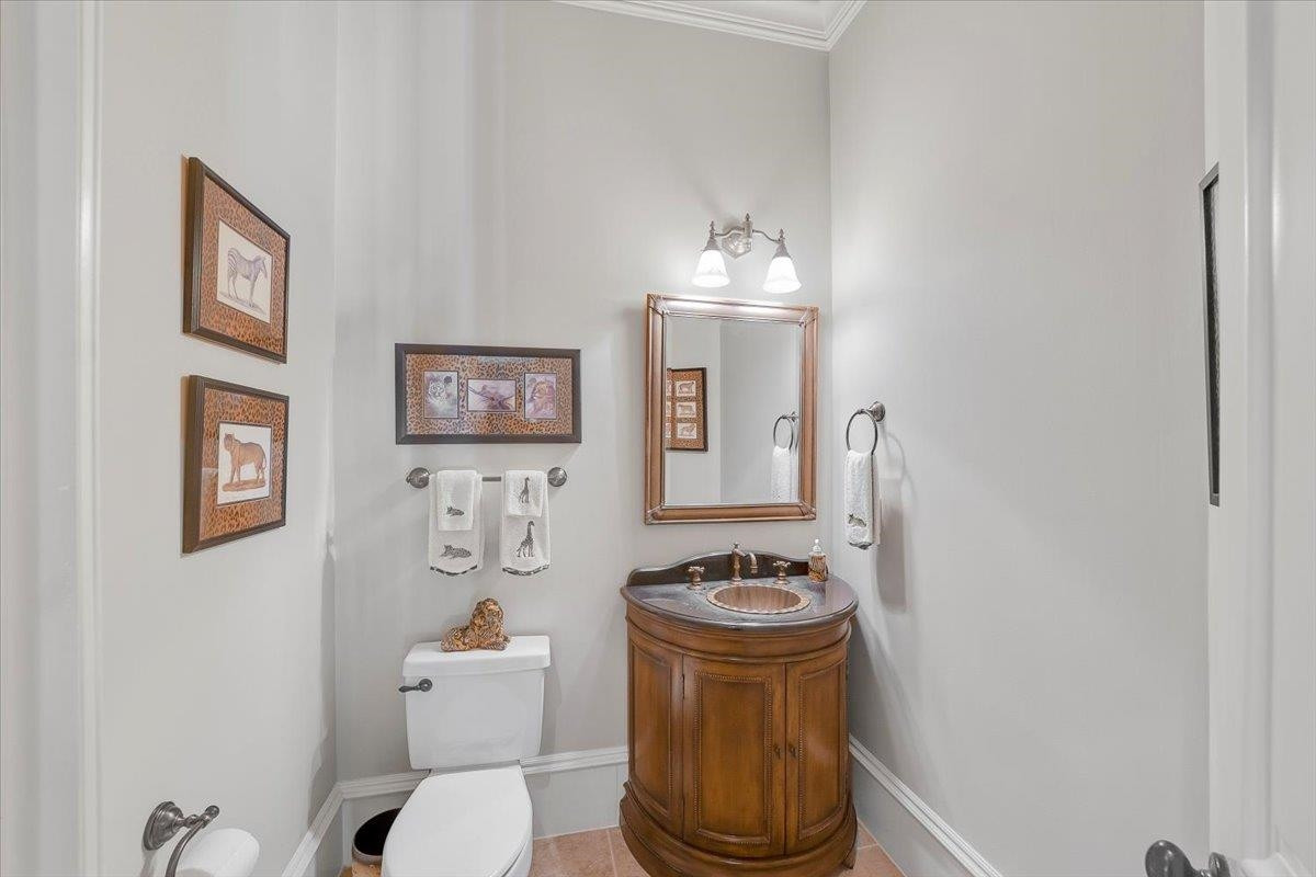 9712 Honeycutt Road Raleigh, NC 27614 - Photo 29 of 83 a bathroom with a toilet sink and mirror