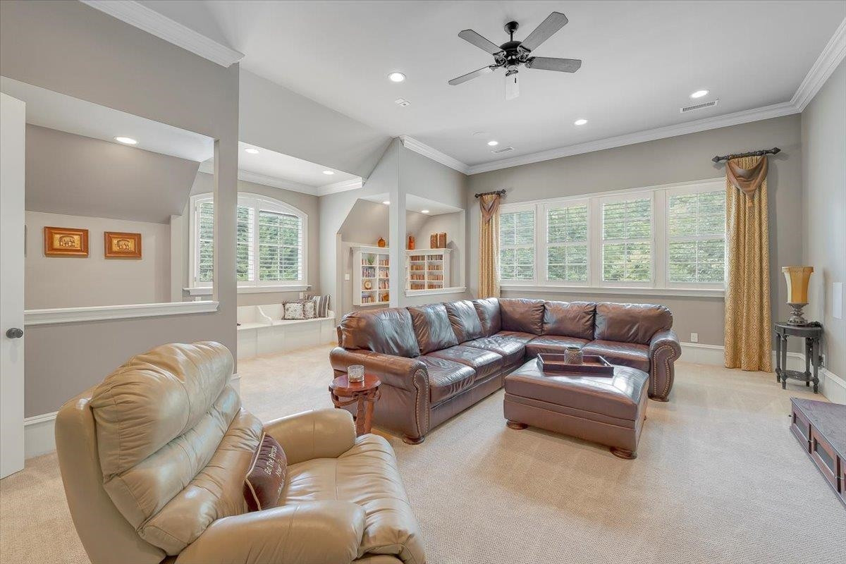 9712 Honeycutt Road Raleigh, NC 27614 - Photo 35 of 83 a living room with furniture and a large window