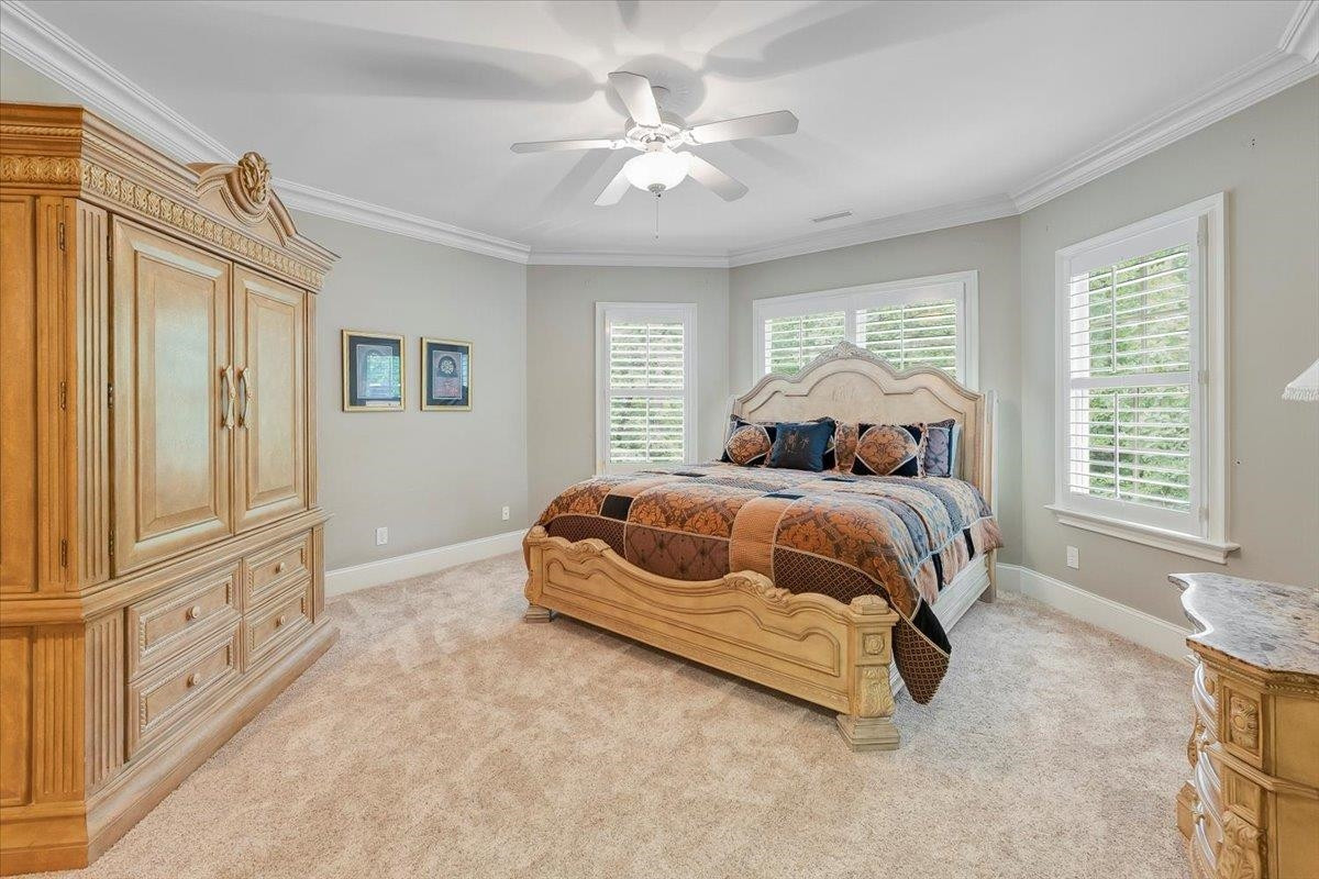 9712 Honeycutt Road Raleigh, NC 27614 - Photo 38 of 83 a spacious bedroom with a bed and a window