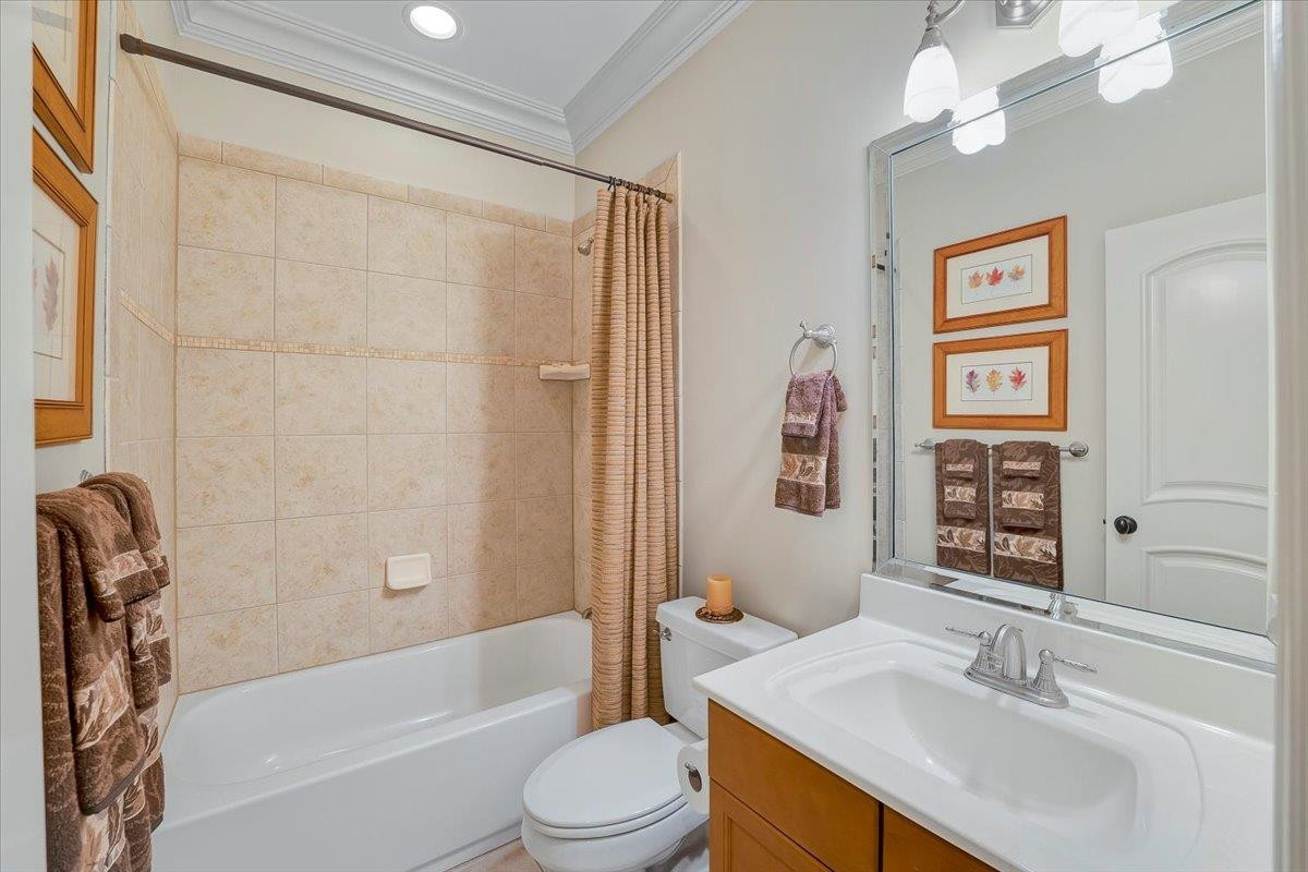 9712 Honeycutt Road Raleigh, NC 27614 - Photo 41 of 83 a bathroom with a sink a toilet and shower