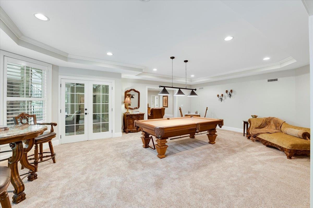 9712 Honeycutt Road Raleigh, NC 27614 - Photo 49 of 83 a living room with furniture a table and a large window