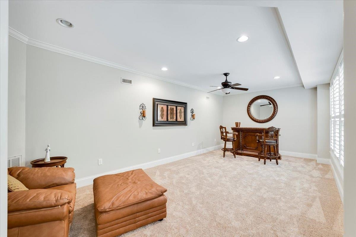 9712 Honeycutt Road Raleigh, NC 27614 - Photo 50 of 83 a living room with furniture and a window
