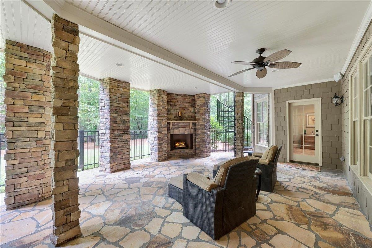 9712 Honeycutt Road Raleigh, NC 27614 - Photo 55 of 83 a living room with furniture and a fireplace
