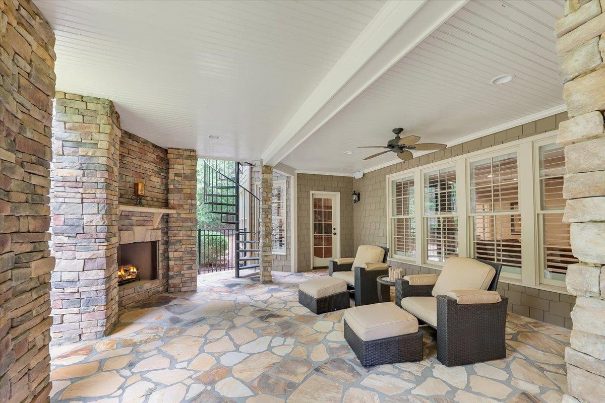 9712 Honeycutt Road Raleigh, NC 27614 - Photo 56 of 83 a living room with furniture large window and flat screen tv