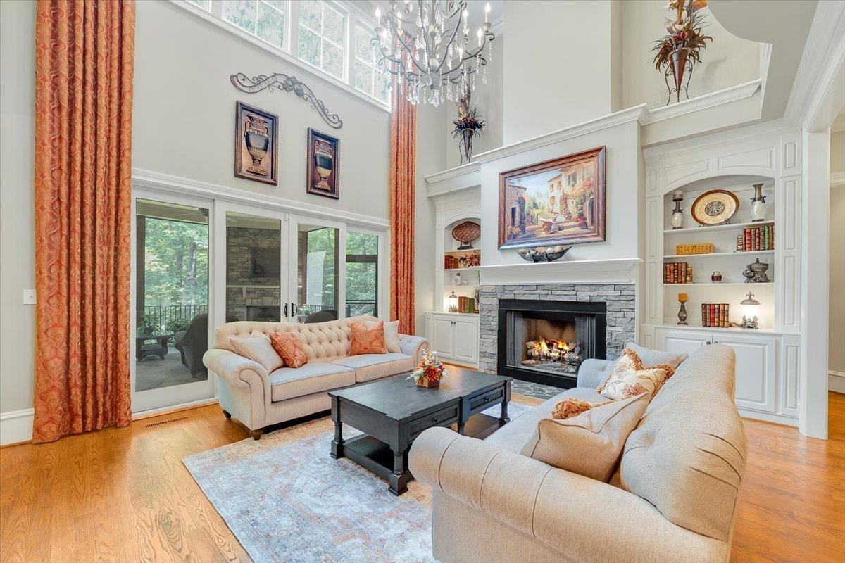 9712 Honeycutt Road Raleigh, NC 27614 - Photo 7 of 83 a living room with furniture and a fireplace