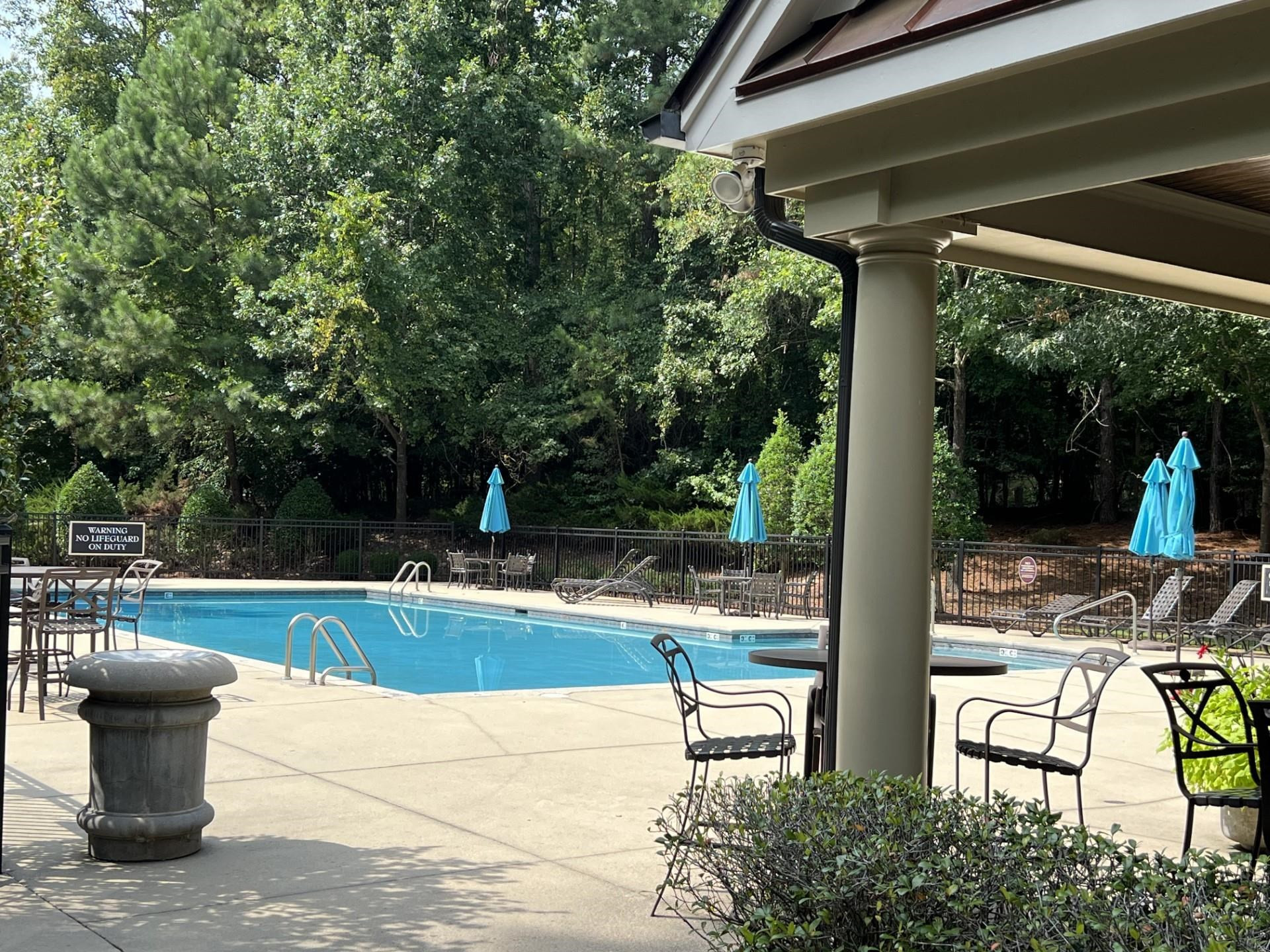 9712 Honeycutt Road Raleigh, NC 27614 - Photo 78 of 83 a view of a patio with table and chairs potted plants with wooden floor and fence