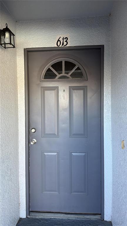 2323 McCoy Road, Unit 613 Orlando, FL 32809 - Photo 3 of 13 a view of a hallway with a door
