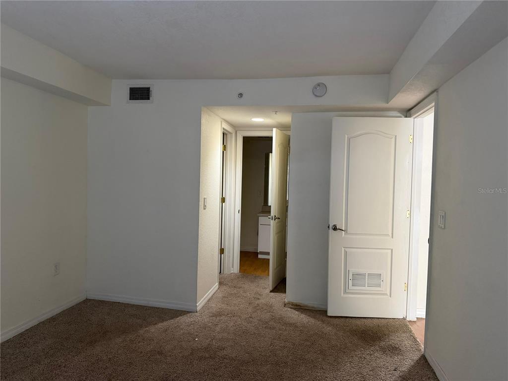 2323 McCoy Road, Unit 613 Orlando, FL 32809 - Photo 7 of 13 an empty room with closet