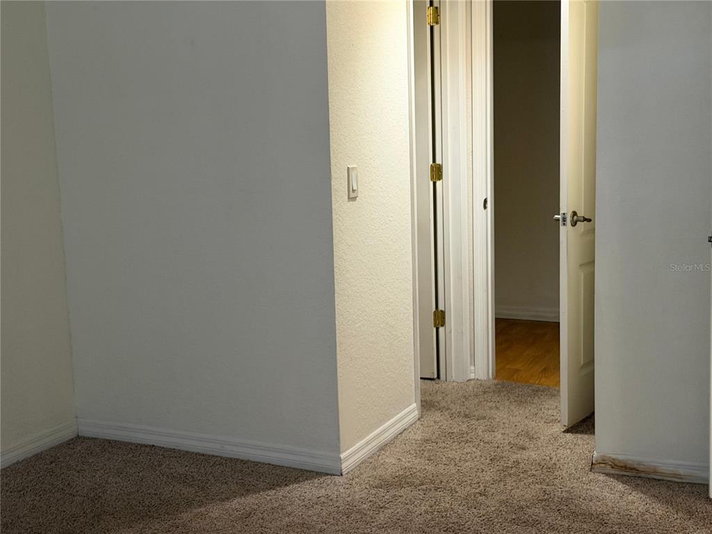 2323 McCoy Road, Unit 613 Orlando, FL 32809 - Photo 8 of 13 a view of a hallway