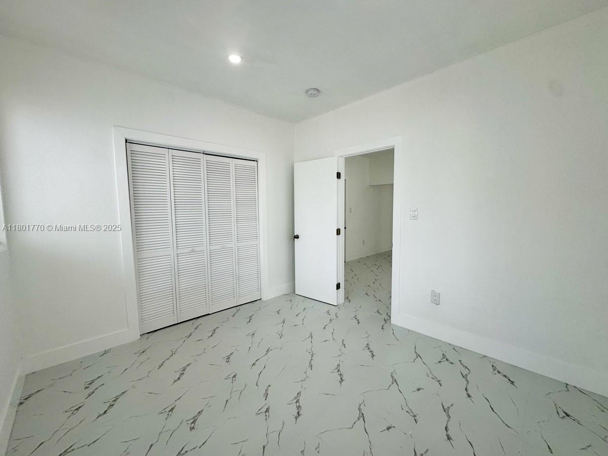 856 Southwest 6th Street, Unit 102 Miami, FL 33130 - Photo 6 of 9 wooden floor in an empty room