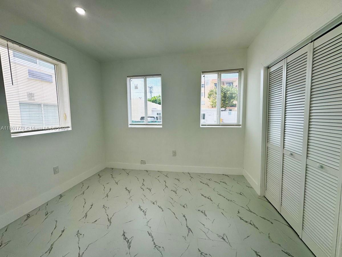 856 Southwest 6th Street, Unit 102 Miami, FL 33130 - Photo 7 of 9 a view of an empty room with a window