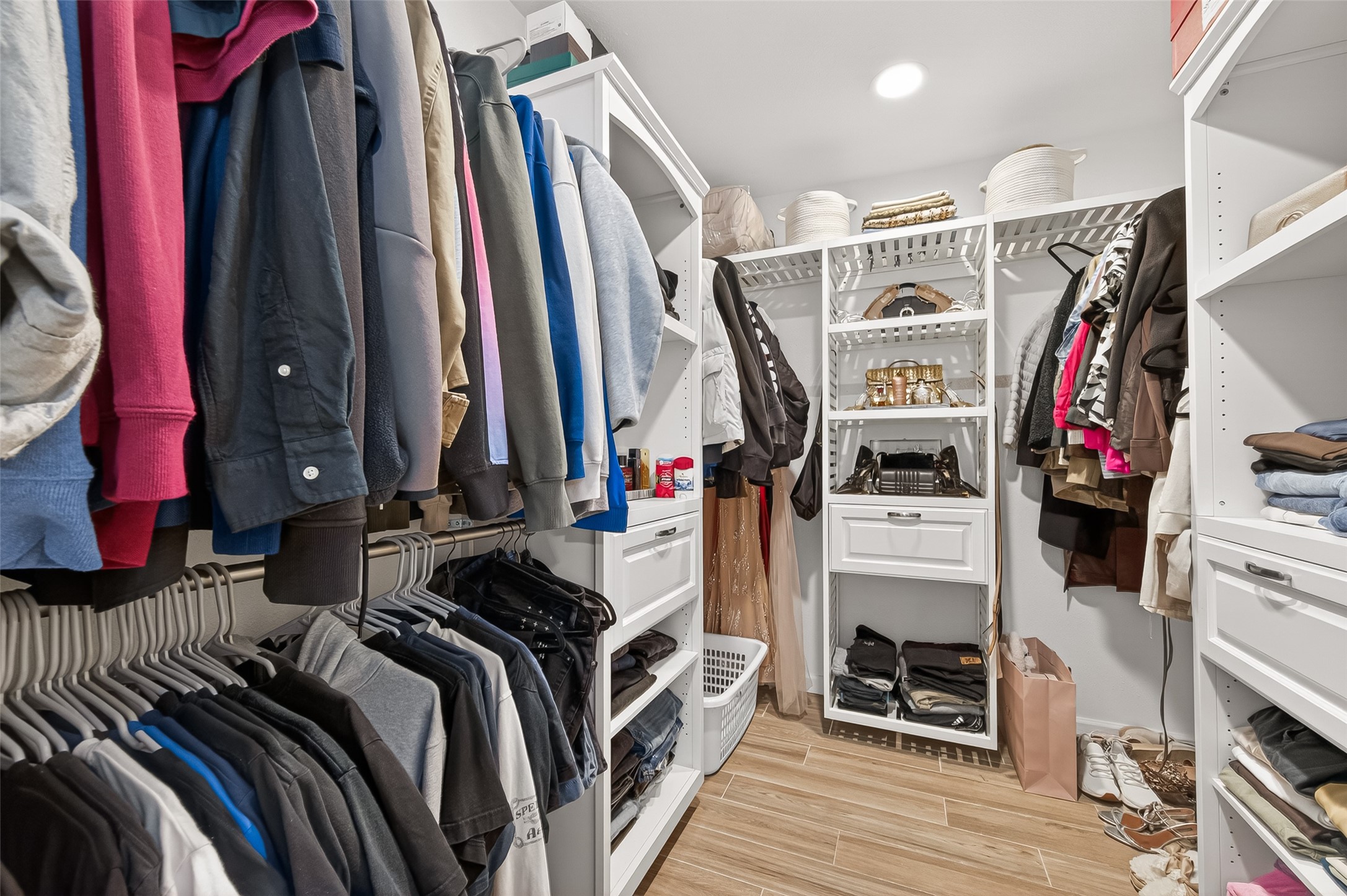 548 Brandon Road Conroe, TX 77302 - Photo 18 of 37 Primary walk in closet is adorned with shelves, drawers, and plenty of space to make getting dressed a breeze!