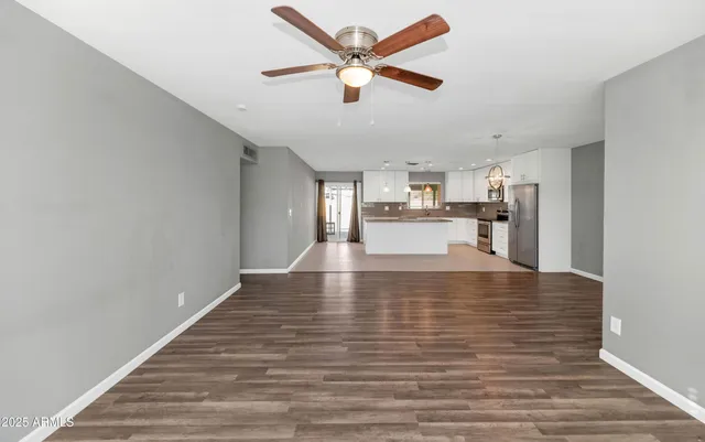 a view of a kitchen with a sink and cabinets